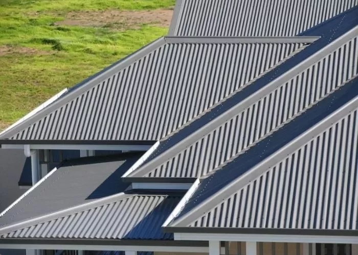 Commercial re roofing Adelaide — new Colorbond sheeting installed over an existing commercial roof structure