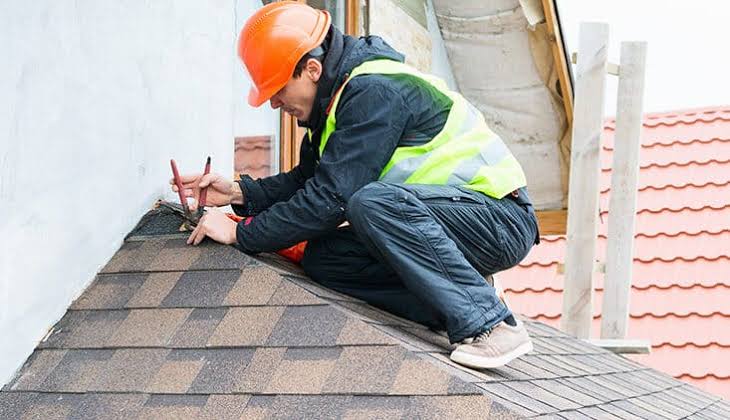 Industrial roof maintenance Adelaide — technician conducting a scheduled roof inspection on a factory roof